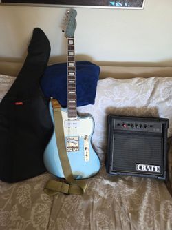 Guutar with gig bag and amp. $300