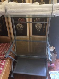 Tempered glass table with shelf and wheels