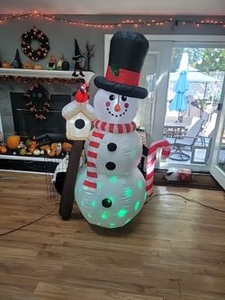 6ft. Snowman Holding a red bird.