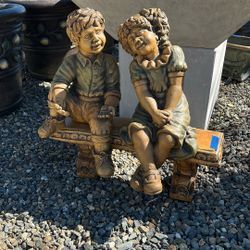 Boy And Girl Statues 