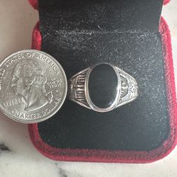 Vintage 925 Sterling silver w/ Blk onyx center, has a cross detail on one side and an eagle on the other side, size 12.25, marked Sterling , nice ring