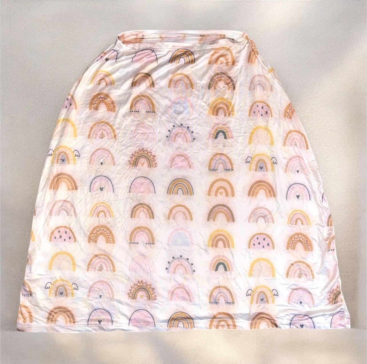 baby car seat canopy or cover with a rainbow pattern.