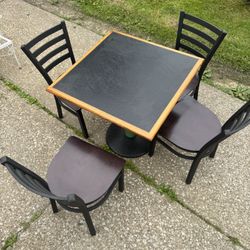 HEAVY TABLE W/ 4 CHAIRS