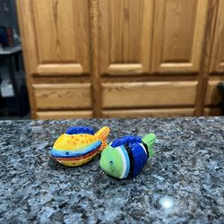 Mini Ceramic Tropical Fish Pair of Salt and Pepper Shakers.  Brand new with stickers on the bottom.  Has been on display in a cabinet with a very larg