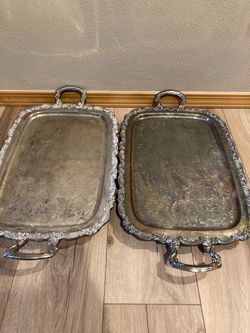 2 - 19” x 13 1/2” silver plated trays one missing a foot mount