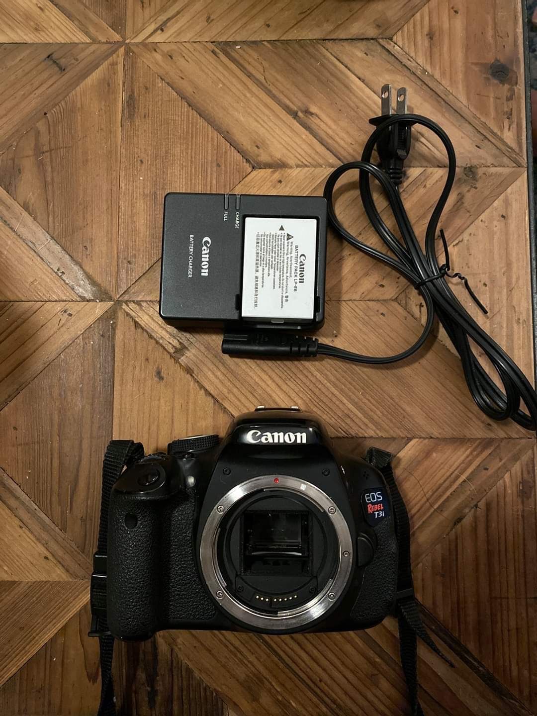 Canon EOS REBEL T3i with charger, camera case, cleaning pack and extra battery