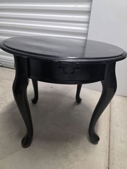 Small round black side table