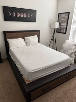 Queen bed and mattress.