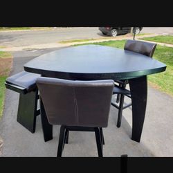 Bar height, dining table with two chairs and bench