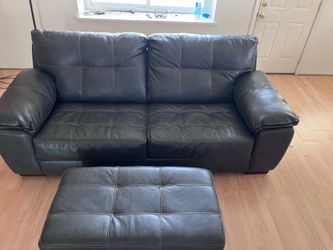 Gently used dark brown leather sofa + ottoman