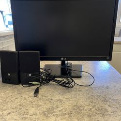 Computer Monitor And Wired Speakers.