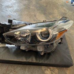 2014-2019 Mazda 3 headlight Left Side driver.