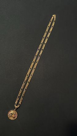 Gold Figaro Chain & World Is Yours Pendant