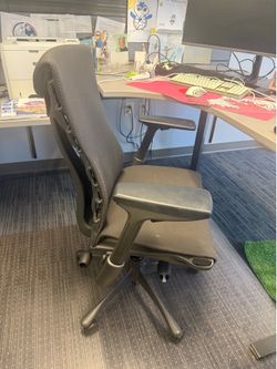 Black office chairs on rollers