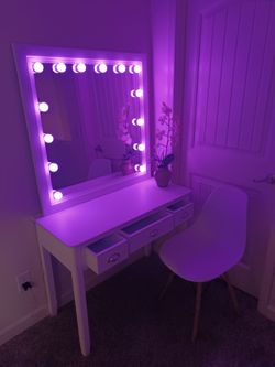 Full vanity set, large white mirror, with multicolor lights. white desk with white drawers,