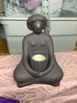 Ceramic seated figurine candle holder