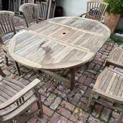 48” round teak expanding table and 6 matching teak chairs (made by wooden duck)  Located in concord  Recently cleaned and teak oiled Heavy and sturdy.