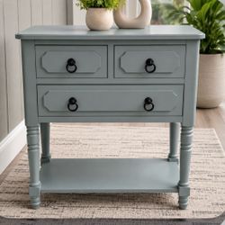 Modern beautiful entry way table with three drawers.