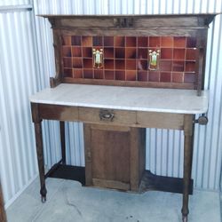 Antique -Edwardian Arts and Crafts oak washstand by Shapland & Petter of Barnstaple, the tile back inset with a Ruskin glazed pottery  