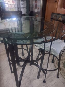 Glass table with 2 chairs.