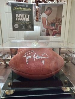 Brett favre signed football in display case with a picture of signing and certificate of authenticity