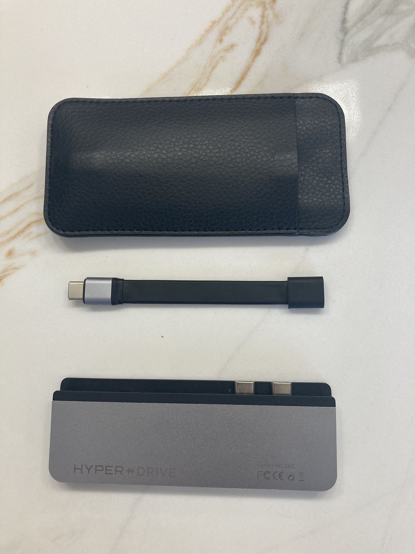 HYPER HyperDrive DUO 7-in-2 USB-C Hub in space gray is an accessory that expands the connectivity options for various Apple devices, including th