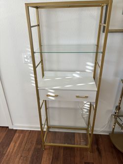 Metal Bookcase With Glass Shelves And Drawer With Power Outlets