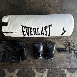 Punching bag (75 or 80lbs I believe)  Gloves 14oz Jump rope Gym Bag