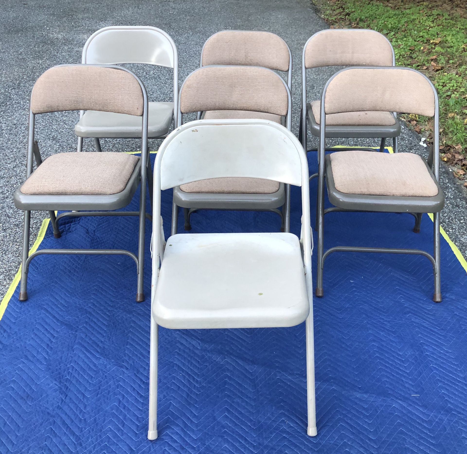 7 chairs and table and also comes with free black chair. (Offers $160 or higher)