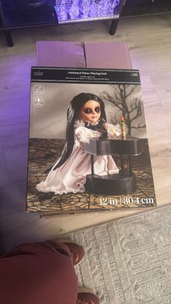 Animated piano playing doll
