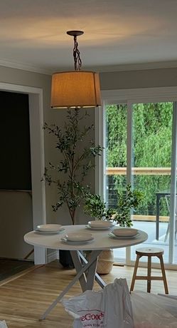 White round dining table with grey metal legs