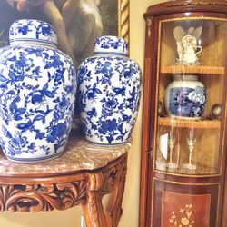 beautiful Asian porcelain pieces decorated in blue and white with flower and landscape themes.