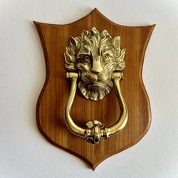 Brass Lion Door Knocker On Wood Shield