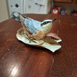 A Lenox porcelain figurine of a Red-Breasted Nuthatch bird.