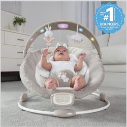Ingenuity InLighten Baby Bouncer Infant Seat with Light Up -Toy Bar, Vibrations, Tummy Time Pillow & Sounds, 0-6 Months Up to 20 lbs (Twinkle Tails Bu