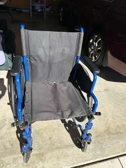 Drive medical Blue Streak wheelchair with flip back desk arms.