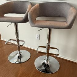 Flash Furniture Erik Contemporary Adjustable Height Barstools, which offer versatility for use at both counter and bar heights. 