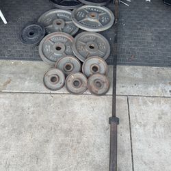 Olympic weights set 310lbs total plus 7ft 45lbs bar