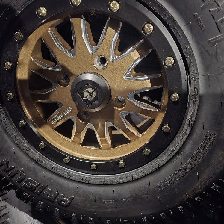 4 NEW 15X33 RIMS&TIRES 4X137 CAN AM X3 LUG PATTERN 