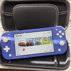Nintendo switch lite with games and case