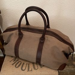 Gently Used Heavy Soft And Sturdy Canvas And Brown Leather Handles And Trim With 5 Rubber Feet On Bottom Of Bag