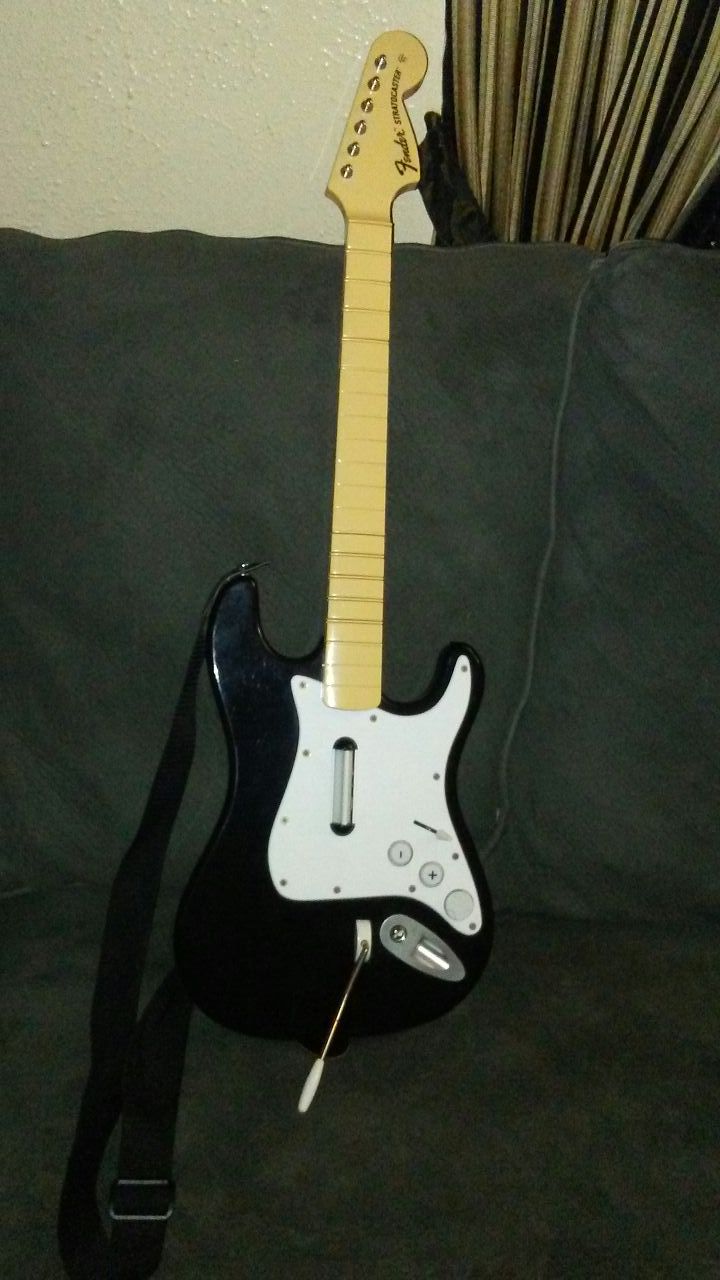 PS2/PS3 WIRELESS GUITAR CONTROLLER $15.00 OBO.