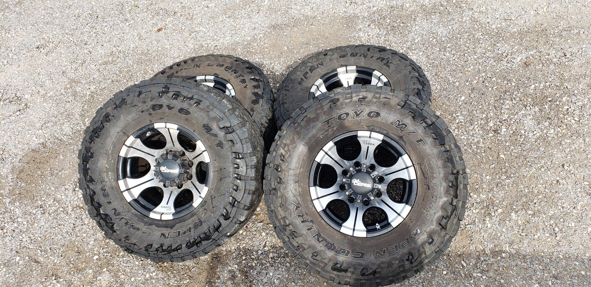 Toyo LT 315/75/16 35x12.50x16 Open Country Tires with Dick Cepek Wheels 8x170 Pattern