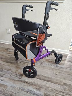 Walker with seat and storage bag