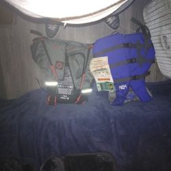 Two Life Jackets ,(0ne Fluid ,and One Onyx)