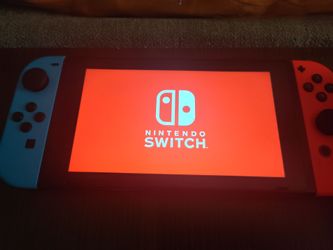 Nintendo switch, like new with all accessories and four games.