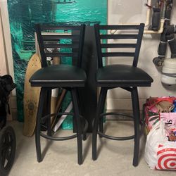 Pair of 30” Black Ladder Back Swivel Cushioned Metal Bar Stools