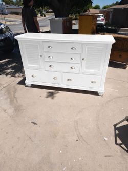 Freshly painted real wood seven drawer dresser with two storage areas one on each side behind each door
