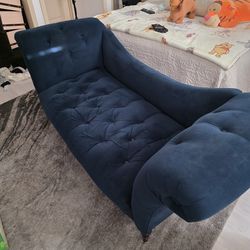Blue tuffed lounge chair