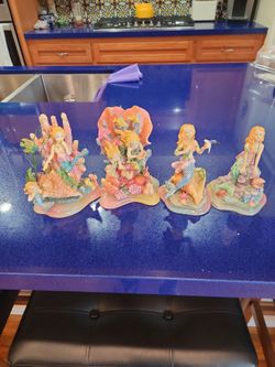 Intricate glittering set of Mermaid figurines
